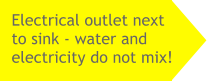 Electrical outlet next to sink - water and electricity do not mix!