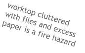 worktop cluttered with files and excess paper is a fire hazard